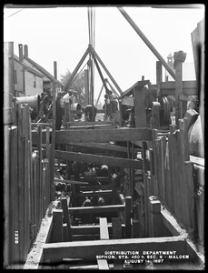 Distribution Department, Low Service Pipe Lines, Section 6, siphon under Spot Pond Brook, station 460+, Jackson Street, from the north, in trench, Malden, Mass., Aug. 14, 1897