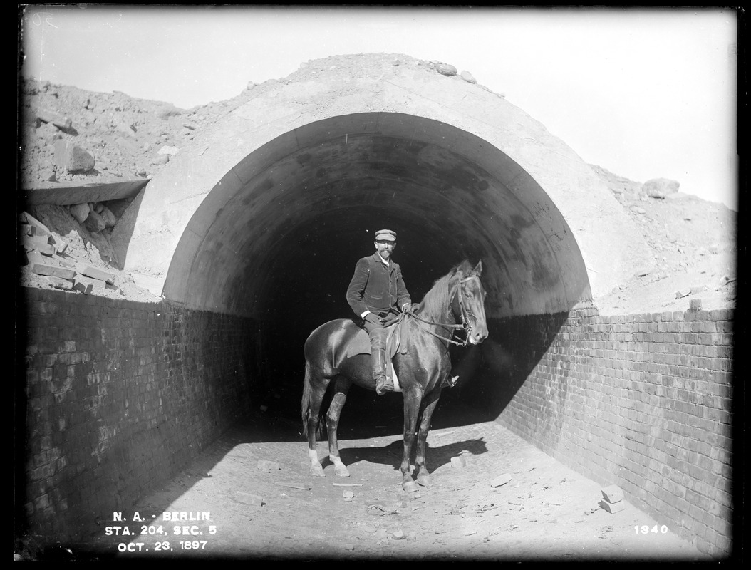 Wachusett Aqueduct, section of aqueduct, with Mr. Silvio Casparis on horseback; Silvio A. Casparis (1849-1921) was a contractor from Columbus, Ohio (Contract Nos. 19, 20, 21, 22, 24, 25), Section 5, station 204, Berlin, Mass., Oct. 23, 1897