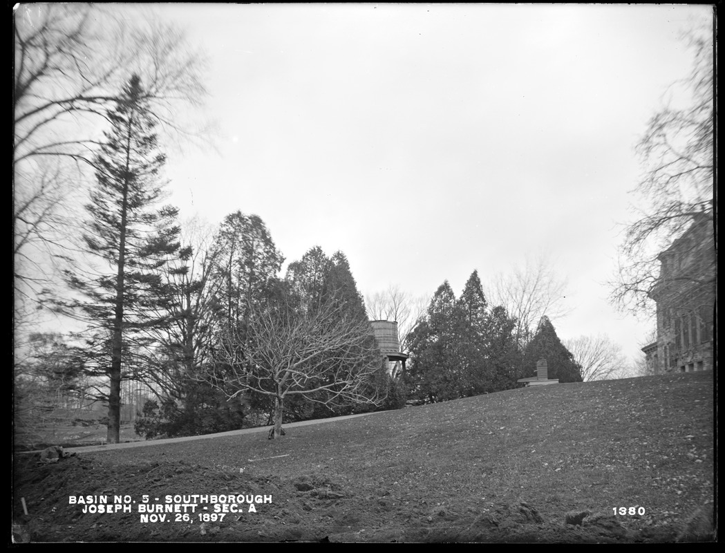 Sudbury Reservoir, Section A, line of cedars, water tank and pump back of the Joseph Burnett house, from the east on lawn, Southborough, Mass., Nov. 26, 1897