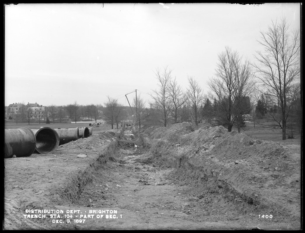 Distribution Department, Low Service Pipe Lines, part of Section 1, trench from the west, at end of excavation, station 10+, Brighton, Mass., Dec. 3, 1897