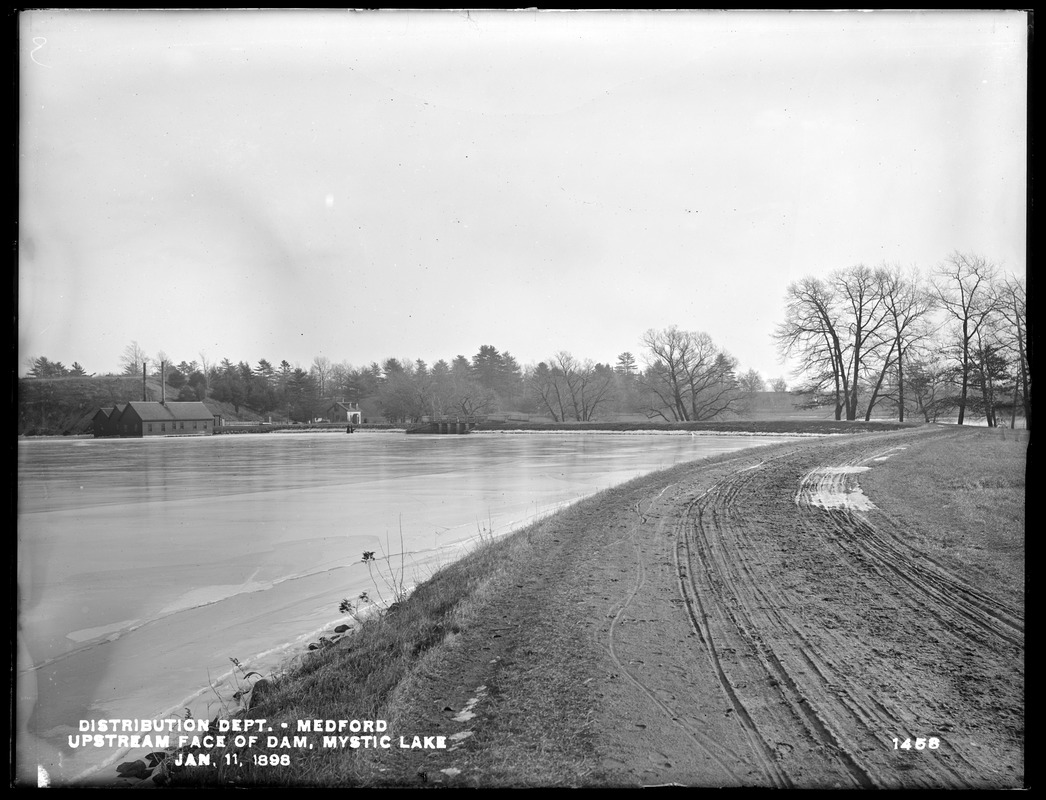 Distribution Department, Mystic Lake, upstream face of Dam; Attendant's house in the background, Medford, Mass., Jan. 11, 1898