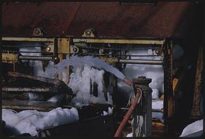 Ship machinery with hose, ice, and snow