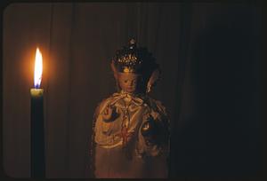 Infant de Prague statue with candle