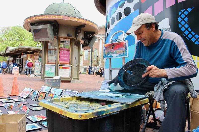 Antonio Maycott selling art in Harvard Square