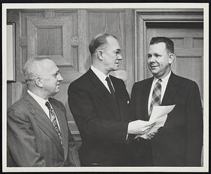 President Harold C. Case of Boston University, reads letter informing him that Boston University has been selected to receive a gift of $5000 under a new educational aid program of the Westinghouse Electric Corporation. Looking on are A.E. Lambert, (right) Agency and Construction Area Manager of Westinghouse's Boston District, who presented the letter of notification, and Prof. Norman H. Abbott, Director of the University's Placement Service. Westinghouse is presenting gifts to a number of colleges and universities throughout the nation to help defray their current operating expenses.
