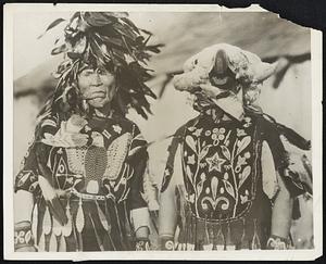 Indians Have Celebration. Beautifully embroidered costumes were worn by Indians who took part in the historically significant Crane Dance, presented for the first time in many years at the celebration of the anniversary of the signing of the Stevens Indian Peace treaty. which was drawn up after Indian wars in 1885. Frank Hillaire of the Lummi tribe gazes thoughtfully into space as if remembering days when ceremonial dances were more frequent and there were no paleface photographers to interrupt and order the performers around. His head covered with a weird headdress of crane feathers, is Joseph Hillaire, son of Frank.