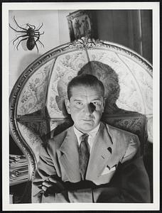 Cartoonist in a Macabre Setting. A black metal spider on the wall and a high-backed chair whose top curls over the head of the sitter and creates an echo in conversation furnish the setting here for Charles Samuel Addams in his Westhampton, L.I.,home. For the 41-year-old cartoonist, A Long-time artist on the staff of The New Yorker Magazine, The Macabre and The Ghoulish find as much expression in the Things he collects as they do in the characters he sets down on his drawing board.