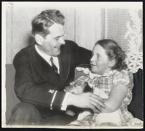 Home on Leave-Warrant Officer George Selkirk, one-time New York Yankee outfielder, tells his eight-year-old daughter, Betty Louise, how it goes in the Navy. He is home on [illegible Rochester, N. Y.