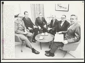 Roundtable Discussion -- Labor Department officials and union leaders meet today in Washington to try to head off a threatened nationwide railroad strike scheduled for Dec. 11. From left are Harold Crotty, president, Brother of Maintenance of Way; Richard Smith, vice president, Hotel and Restaurant Workers; George Ives, chairman, National Mediation Board; Charles Luna, president, Brotherhood of Railroad Trainmen; C.L. Dennis, president, Railway Clerks; and W.J. Usery, assistant secretary of labor.