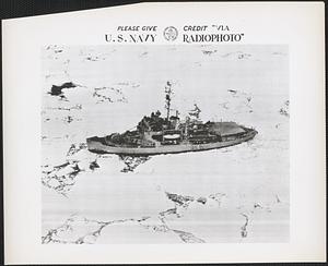 USS Burton Island, flagship of Task Force 39, smashing its way through pack ice of Antarctic coastal waters