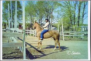 Andrew Howard riding Trigger in yard