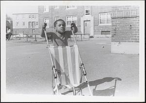 Jared pushing a stroller in Newtowne Court