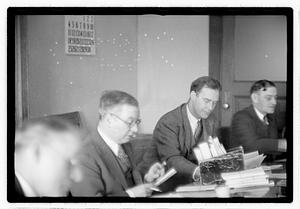Group of men at table