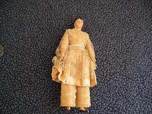 Painted paper mâché small doll in lacy clothing