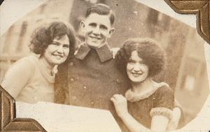 Unidentified U.S. Marine and two women