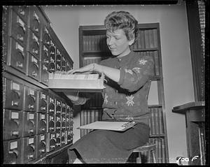 Looking through a card catalog