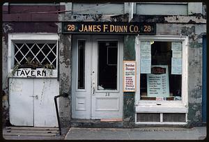 Front of shop with signs "28 James F. Dunn Co. 28" and "Butcher Shoppe" next to sign pointing to 1826 tavern