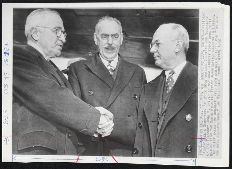 President Greets Acheson, Snyder--President Truman greets Secretary of State Dean Acheson (center) and Secretary of the Treasury John W. Snyder at National Airport today upon their return from the North Atlantic Treaty Organization meeting in Lisbon. The chief executive congratulated both cabinet officers for "the job you have accomplished."