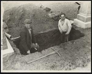 Workers shown as they started to exhume the body of Mrs. Eva. Pelletier Roy in Sacred Heart cemetery, Lawrence, today. Exhumation was halted, however, just as the casket was reached, because Andover town clerk refused to give a permit to remove the body unless given such an order by the district attorney. The district attorney's office refused.