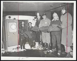 Boston Bedlift, 1956, looked like this as American Red Cross disaster truck delivered cots and blankets to Herald building for employes working through the night, and for those stranded miles from their homes. Other cots and blankets were provided by Boston Civil Defense unit.