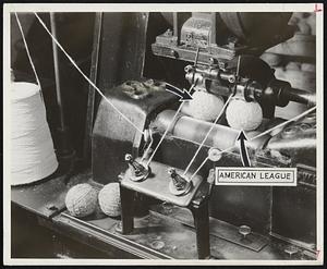 National and American League baseballs being wound by control-tension machines at huge A. G. Spalding plant in Chicopee. Balls are exactly the same in every detail.