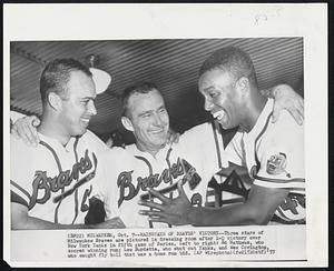 Mainstays of Braves' Victory--Three stars of Milwaukee Braves are pictured in dressing room after 1-0 victory over New York Yanks in fifth game of Series. Left to right: Ed Mathews, who scored winning run; Lew Burdette, who shut out Yanks, and Wes Covington, who caught fly ball that was a home run bid.