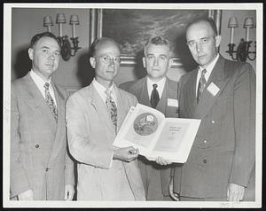Six Years After serving with the First Army in France and Germany these members of the Third Auxiliary Surgical Group Society meet at the clinical congress of the American College of Surgeons. Left to right, Dr. Ronald Adams of 132 Homer street, Newton Center; Dr. Clifford L. Graves of San Diego (holding the Group's official history); Dr. Mark Williams of Binghamton, N. Y.; and Dr. Allen Boyden of Portland, Ore.