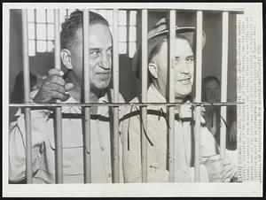 Strike Leaders Jailed--Herbert Sorrell (left), president f the Conference of Studio Unions, and Roy Lockridge, a carpenter and member of the strike strategy committee, stand behind bars of the city jail today after being booked on suspicion of inciting to riot as an outgrowth of strike violence at warner bros. studio.