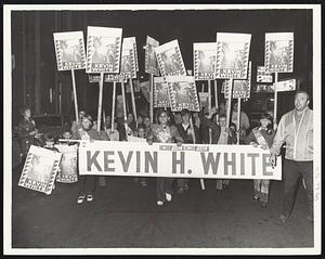Youngsters waving placcards favoring Kevin White for Gov. march along Hanover St. during No. End political rally.