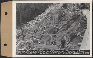 Contract No. 82, Constructing Quabbin Hill Road, Ware, looking ahead at ledge and forms for retaining wall from Sta. 24+45, Ware, Mass., Aug. 29, 1939