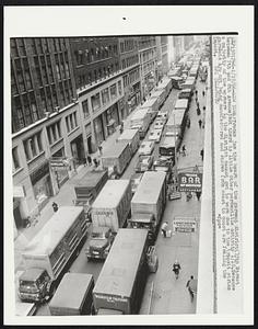 Trucks jam the heart of the garment district (35th Street between 7th and 8th Avenue) but there is little other perceptible activity 1/10. Because a majority of the workers in the district cannot get to work due to the transit strike garments are not being manufactured and stores from coast to coast are feeling the impact.