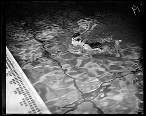 A person swimming in a pool