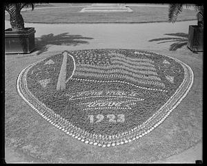 Flowerbed showing a flag with inscription "Long May It Wave 1923" underneath, Boston Public Garden