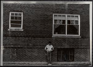 Young woman standing in Newtowne Court