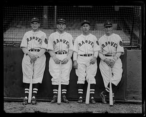 Four Boston Braves players pose with bats