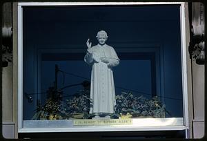Window with statue of man in religious dress and plaque "In Memory of B. Frank Allen"