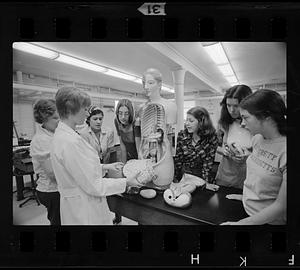 Student nurses learn anatomy using dummy, Boston
