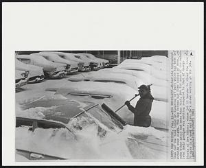 Des Moines - Big Brush-Off - Motorists throughout Iowa had the task today of cleaning off cars which had been left outside over night. The Des Moines had five inches of snow, and some other areas had more than that. But for most of the motorists their problem was nothing compared to that of George Starks of Des Moines, whose job it became to clear the snow from 70 cars in a used car lot. He's shown working at the job.