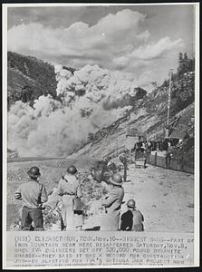 Biggest Bang--Part of Iron Mountain near here disappeared Saturday, Nov.8, when IVA engineers set off 520,000 pound dynamite charge--they said it was a record for construction job--in blasting for IVA's Watauga Dam project now under way.