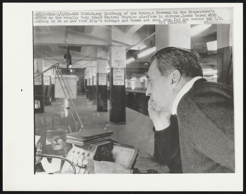 Harry Goldberg of the Bronx, a foreman in the dispatcher's office on the usually busy Grand Central Station platform in midtown, looks bored with nothing to do as New York City's subways and buses are shut down for the second day 1/2.