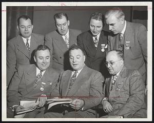 State CIO Officers at the ninth annual convention at Worcester. Seated, left to right, are: J. William Belanger of Worcester, secretary; Joseph A. Salerno of Boston, president; Antonio England of New Bedford, assistant legislative agent. Standing, left to right, Theodore R. Hilli of Worcester, president of the Worcester Industrial Union Council; Mariano S. Bishop of Fall River, chairman of the resolution committee; Charles Auslander, director of the Central Massachusetts Joint Board, and Martin J. Walsh of Worcester, chairman of the constitution and by-laws committee.