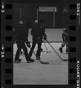 Group playing hockey