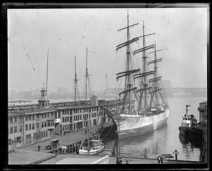 Old T-wharf incl. large 3-masted square rigged ship on right