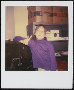 Girl making a peace sign