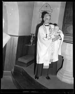 Minister holding Dyan at her christening, Lowell