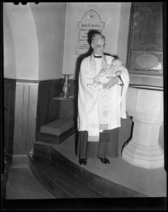 Minister holding Dyan at her christening Lowell