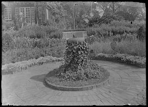 Sun dial, ivy-covered