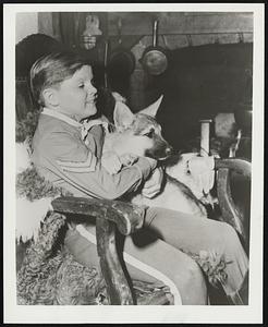 Lee Aaker (Rusty in "The Adventures of Rin Tin Tin") holds Rin Tin Tin's new pup in the ABC-TV segment titles "Eagle's Nest" in which a son is born to Rinty. The authentic Rin Tin Tin puppy will be given away as first prize in a national "Name the Puppy" contest to the youngster who sends in the best name for him. The contest is being sponsored by Nabisco Shredded Wheat.