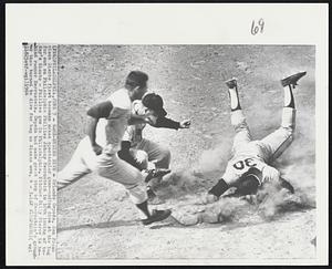 Game Ending Dive - Orlando Cepeda, San Francisco Giants first baseman makes spectacular game-ending dive at the bag for out on Philadelphia Phillies Johnny Herrnstein in 10th inning of today's Giants - Phillies game in Philadelphia. Pitcher Billy Pierce is behind runner Herrnstein. Cepeda had made great stop of Herrnstein's grounder then turned to dive for bag as Giants won, 4 - 3.