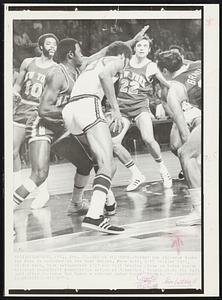 Sag on Alcindor--Bucks' Lew Alcindor looks for room to maneuver as New York Knicks, from left, Walt Frazier (10), Willis Reed, Dave DeBusschere (22) and Bill Bradley close in today during National Basketball Association action at Milwaukee. Knicks stole the ball just after Alcindor had taken a rebound under Bucks' basket.